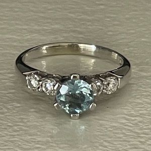 Genuine aquamarine and natural earth mined diamonds set in 14K solid white gold.